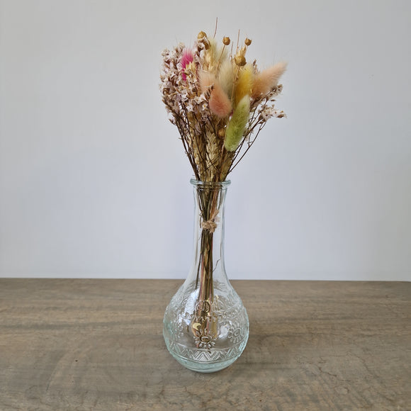 Narrow neck clear vase with dried flowers